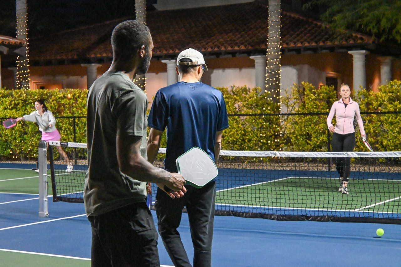Energetic pickleball match under the lights in Scottsdale, Arizona.
